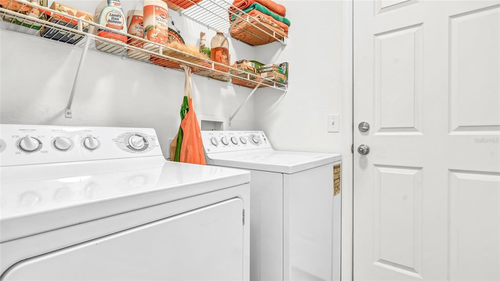 1153 Legatto Loop Dundee, FL 33838 - Photo 33 of 48 a utility room with dryer and washer