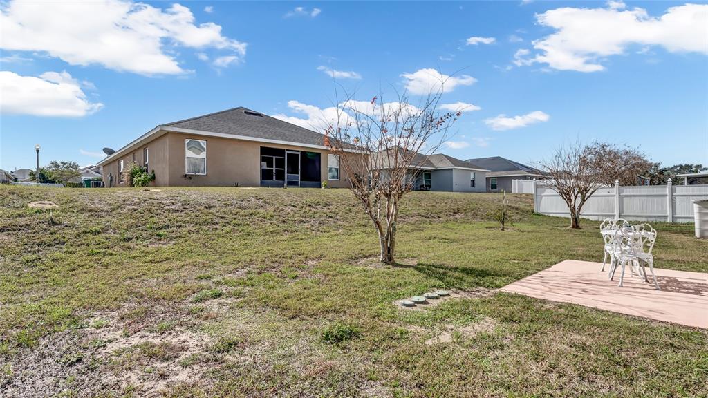 1153 Legatto Loop Dundee, FL 33838 - Photo 37 of 48 a front view of a house with a yard