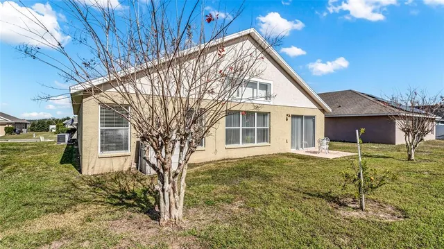 a view of house with yard