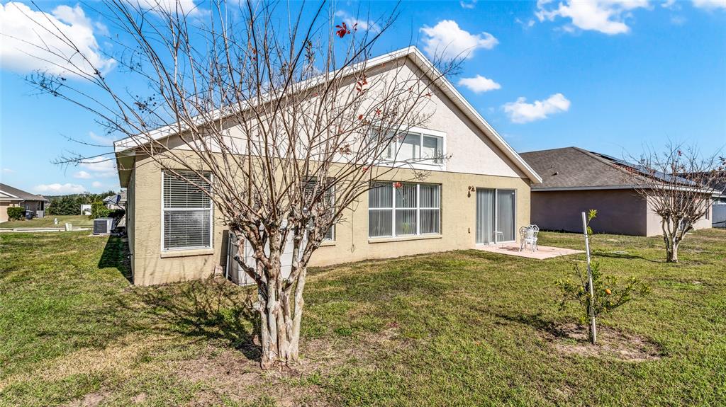 1153 Legatto Loop Dundee, FL 33838 - Photo 38 of 48 a view of house with yard
