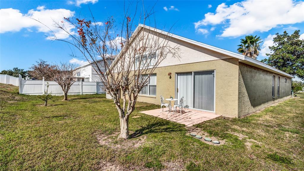 1153 Legatto Loop Dundee, FL 33838 - Photo 39 of 48 a view of backyard of the house