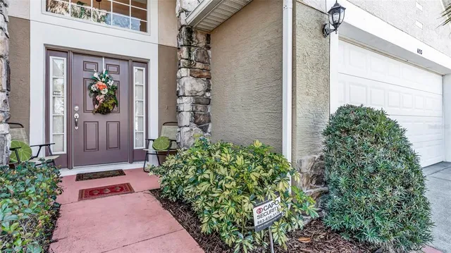 front view of a house with a potted plant
