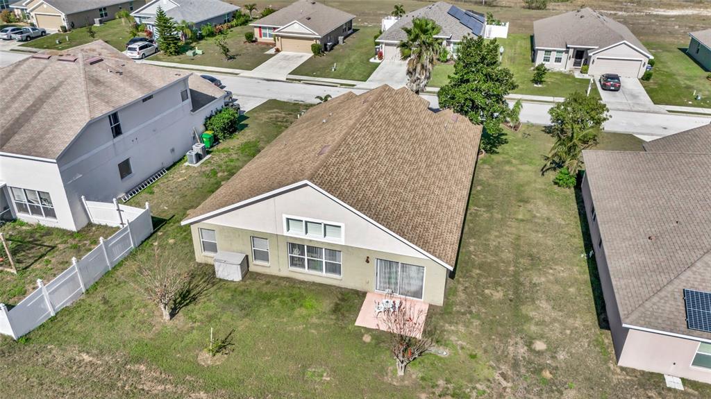 1153 Legatto Loop Dundee, FL 33838 - Photo 45 of 48 an aerial view of a house with swimming pool