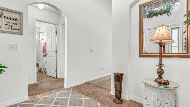 a view of livingroom with furniture and front door