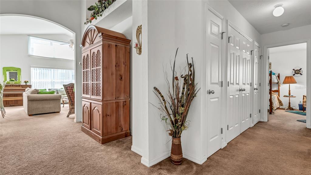 1153 Legatto Loop Dundee, FL 33838 - Photo 8 of 48 a view of hallway with furniture and a potted plant