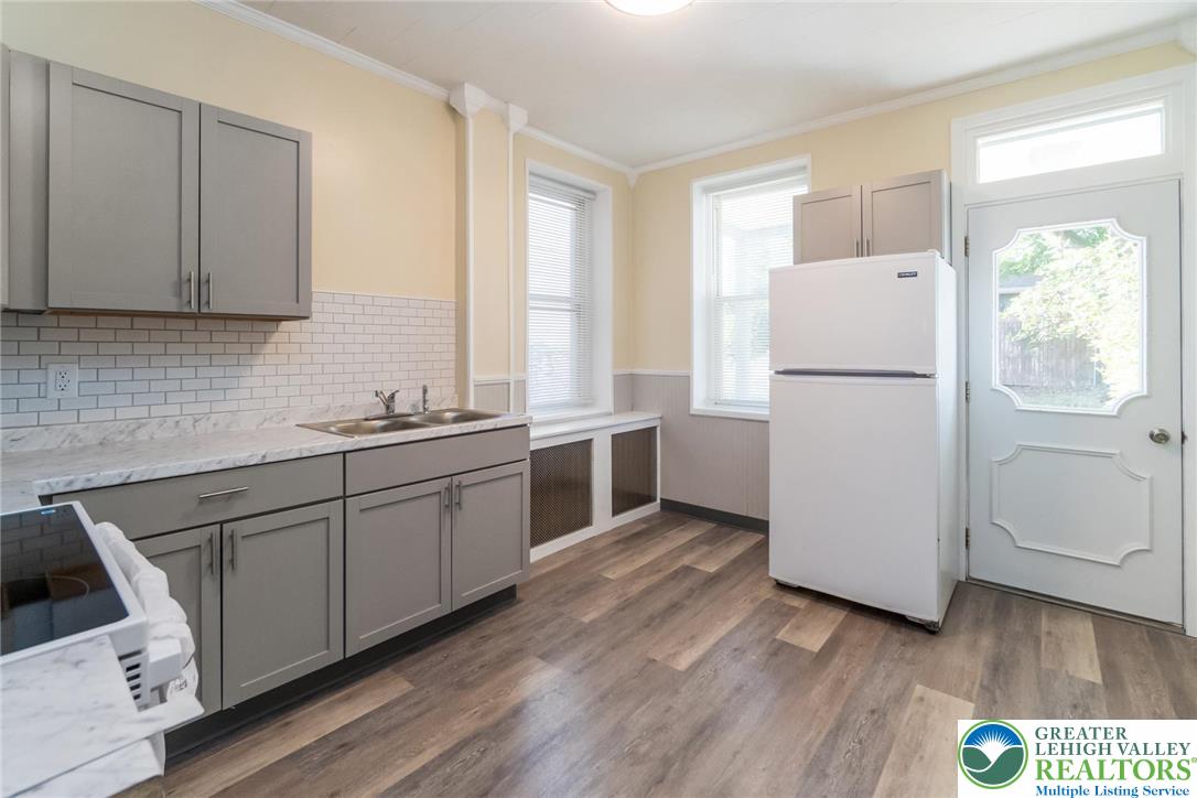 421 Center Street Jim Thorpe, PA 18229 - Photo 16 of 34 a kitchen with a refrigerator sink and cabinets