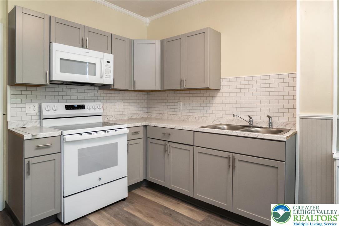 421 Center Street Jim Thorpe, PA 18229 - Photo 18 of 34 a kitchen with cabinets appliances and a sink