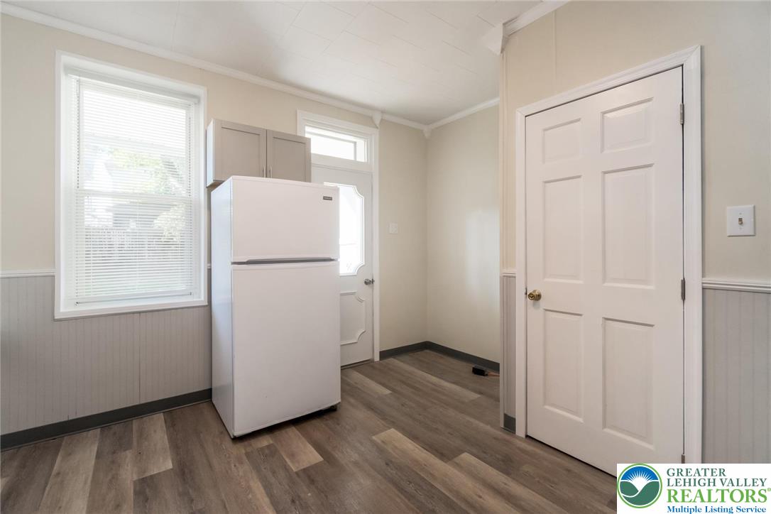421 Center Street Jim Thorpe, PA 18229 - Photo 20 of 34 a view of a room with wooden floor and a refrigerator
