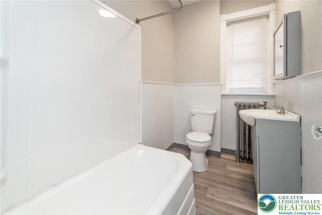 421 Center Street Jim Thorpe, PA 18229 - Photo 32 of 34 a bathroom with a toilet a sink and a window