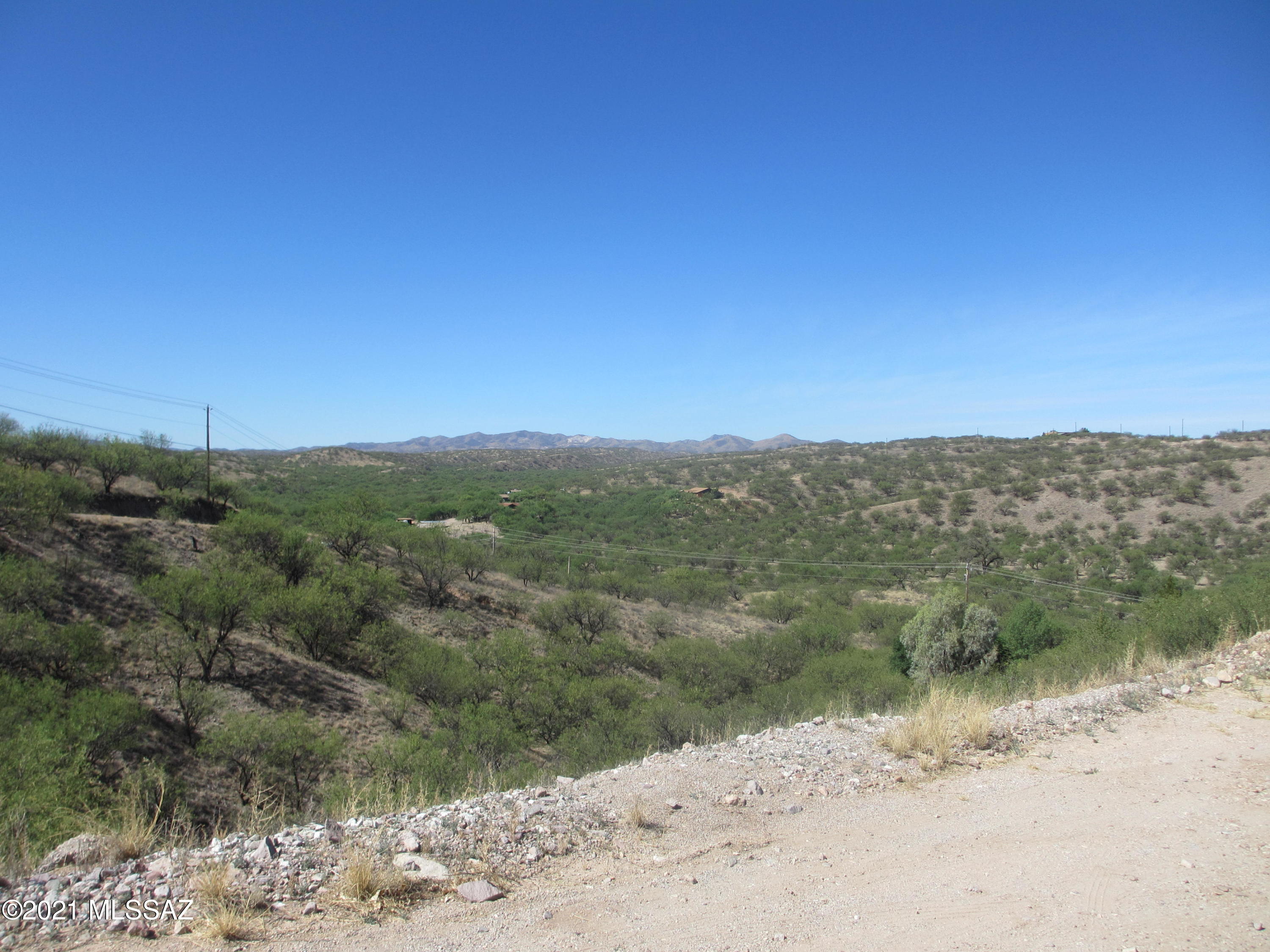 978 Calle Amarillo Rio Rico, AZ 85648 - Photo 15 of 34 a view of a road with a mountain view