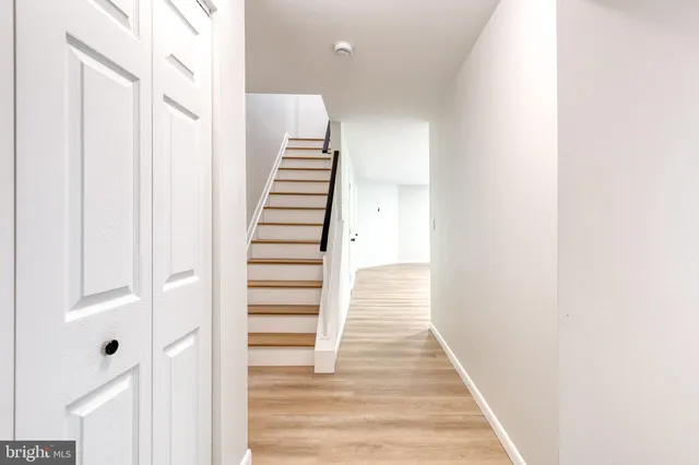 a view of a hallway with stairs