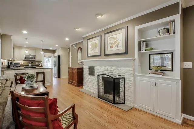 a kitchen with furniture and a fireplace