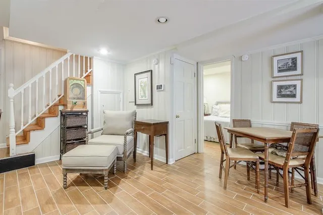a workspace with wooden floor and furniture