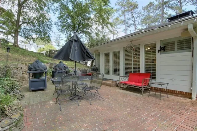 a view of backyard with outdoor seating