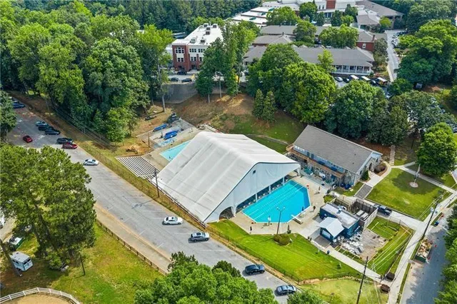 an aerial view of a house with a lake view
