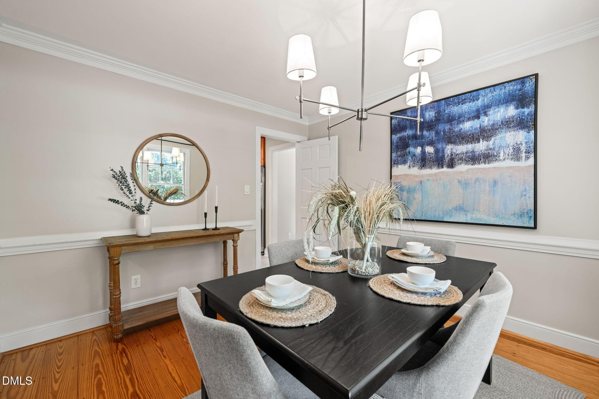 18 Strawberry Ridge Lane Durham, NC 27713 - Photo 23 of 59 a view of a dining room with furniture and a chandelier