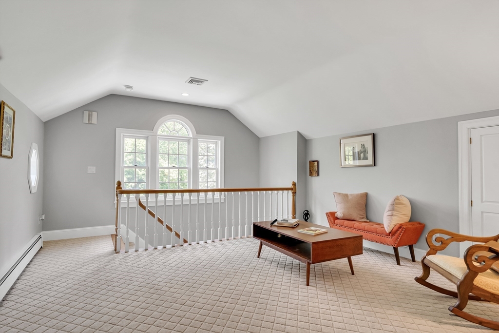 34 Solomon Pierce Road Lexington, MA 02420 - Photo 28 of 42 a living room with furniture a rug and a window