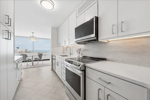 a kitchen with a stove and a microwave