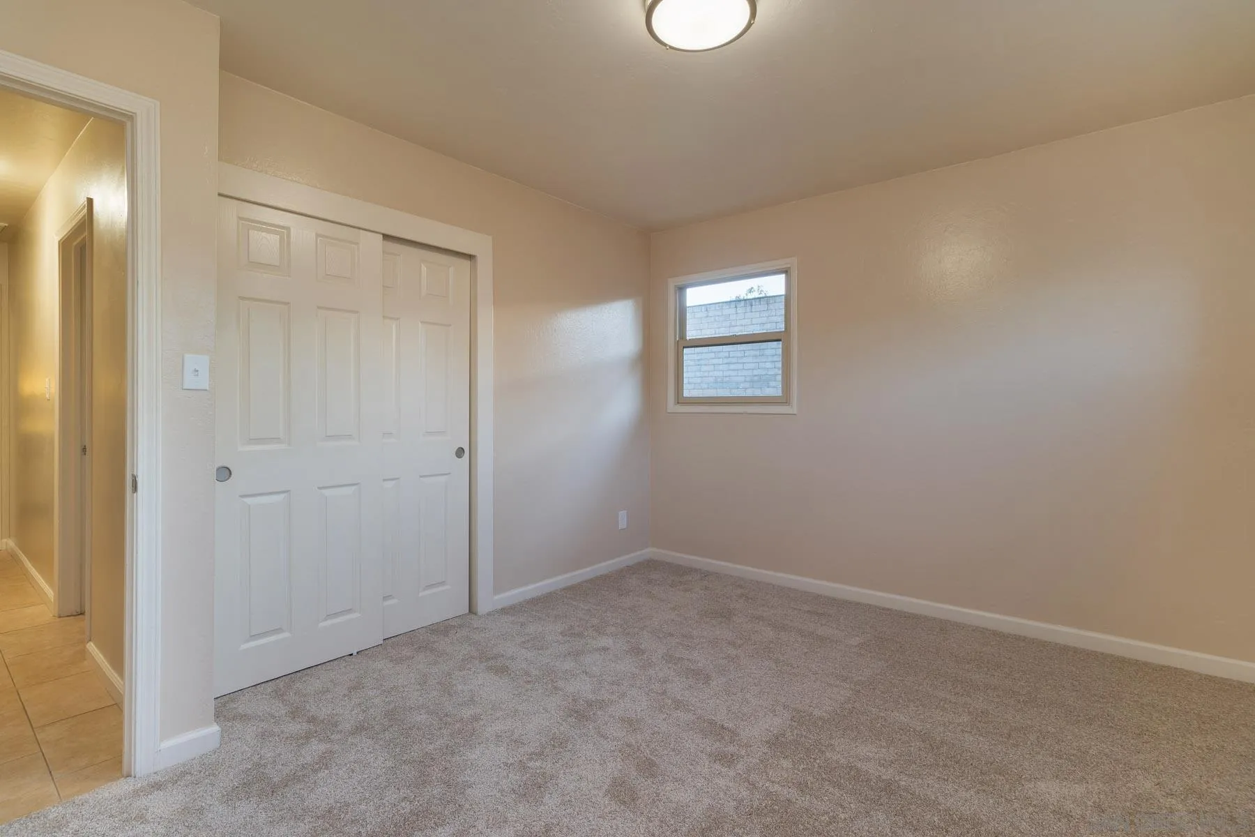 13424 Powers Road Poway, CA 92064 - Photo 16 of 24 an empty room with windows and closet