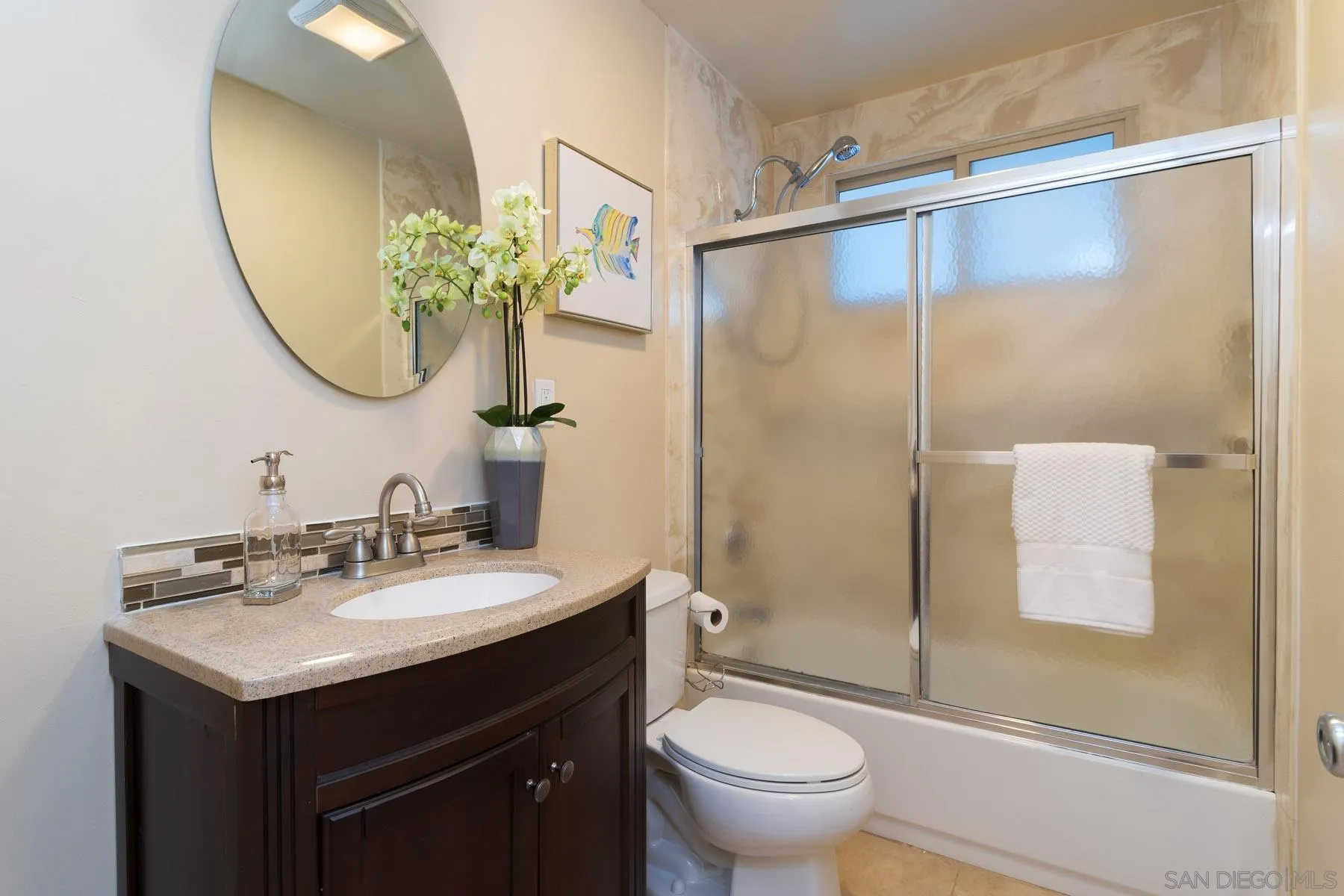 13424 Powers Road Poway, CA 92064 - Photo 17 of 24 a bathroom with a sink toilet and shower