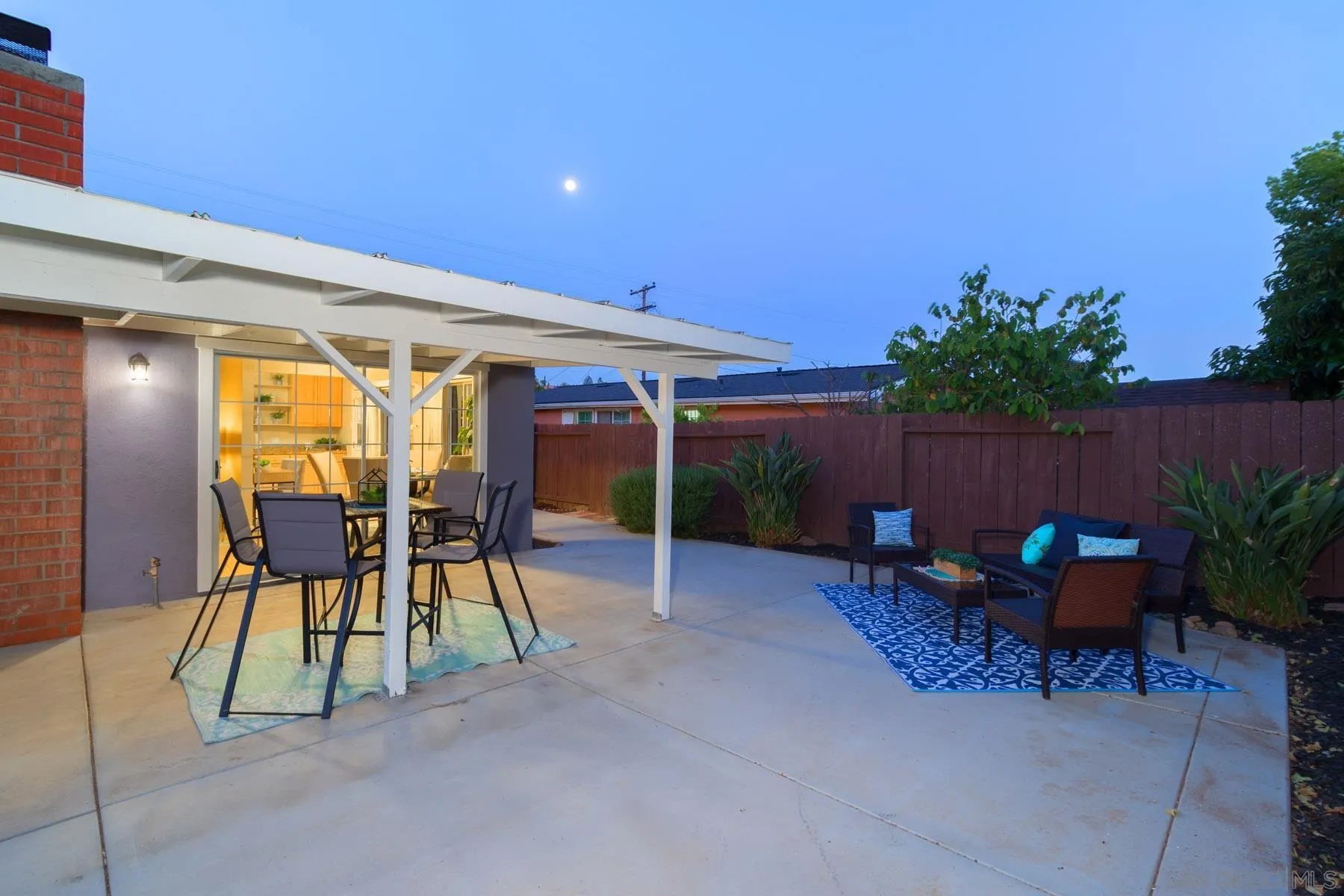 13424 Powers Road Poway, CA 92064 - Photo 20 of 24 a view of a chairs and table in patio with a backyard