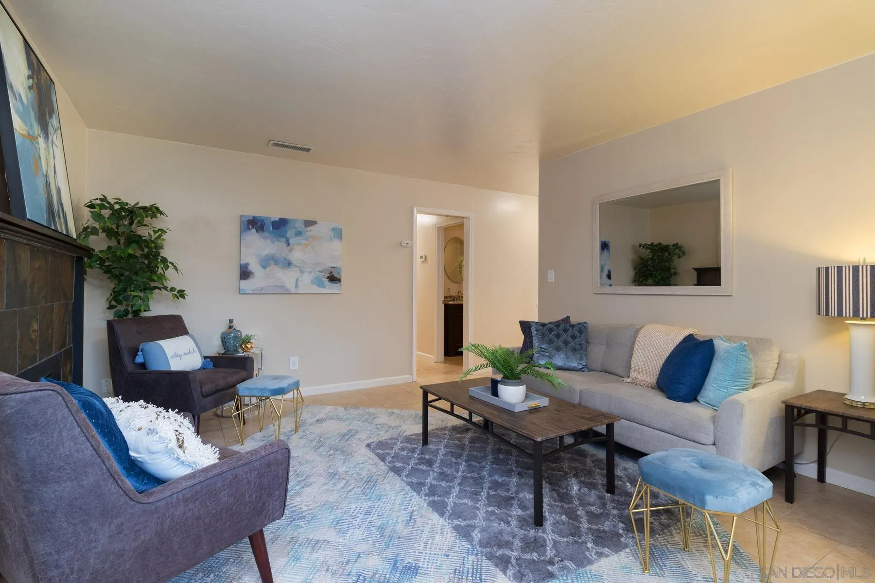 13424 Powers Road Poway, CA 92064 - Photo 3 of 24 a living room with furniture and a potted plant