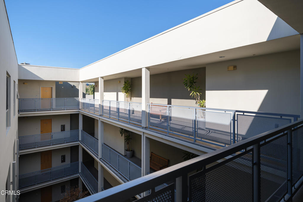 159 West Green Street, Unit 502A Pasadena, CA 91105 - Photo 27 of 50 a kitchen with stainless steel appliances kitchen island granite countertop a stove and cabinets