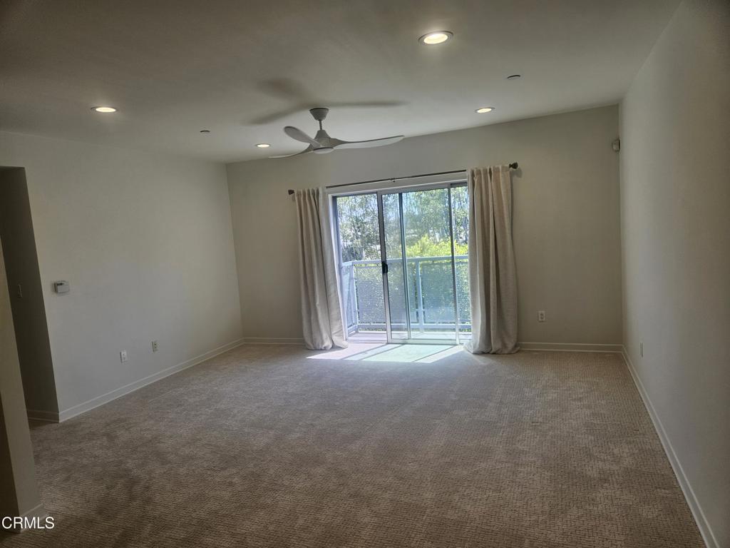 159 West Green Street, Unit 502A Pasadena, CA 91105 - Photo 35 of 40 en empty room with windows and ceiling fan