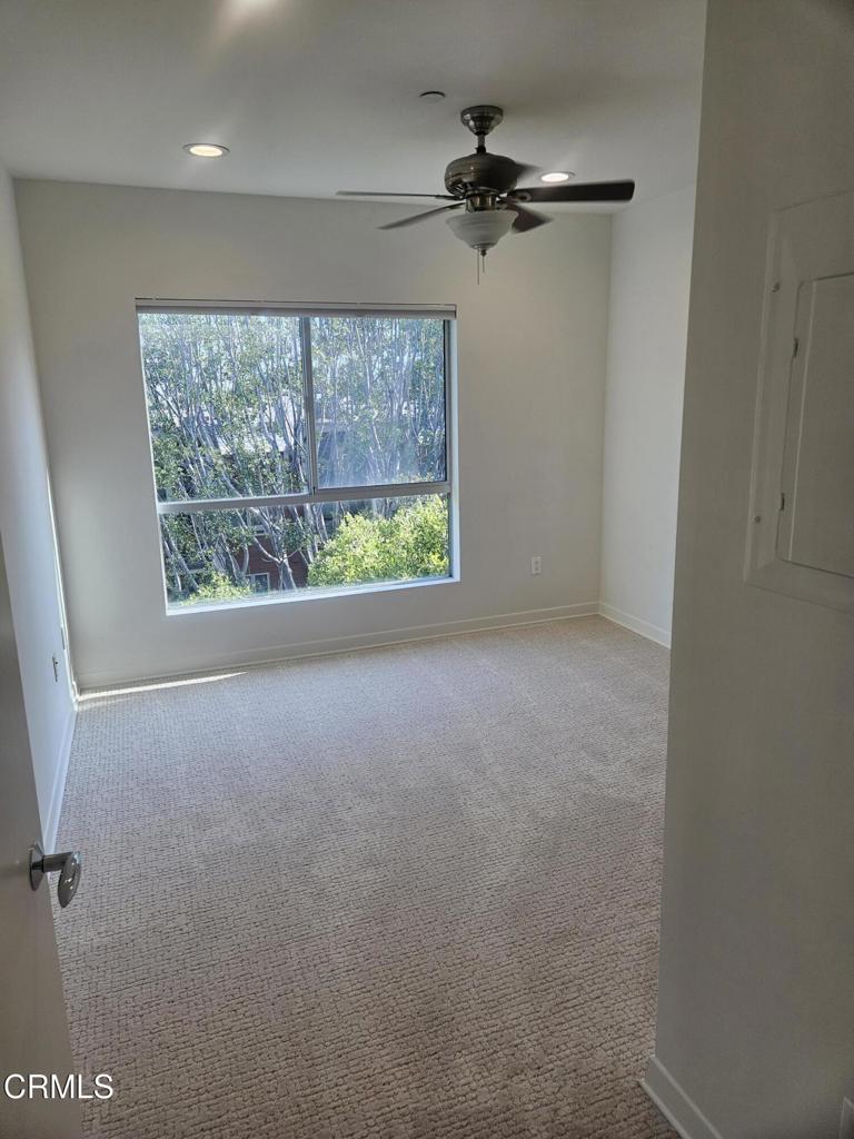 159 West Green Street, Unit 502A Pasadena, CA 91105 - Photo 36 of 40 a view of a livingroom with a ceiling fan and window