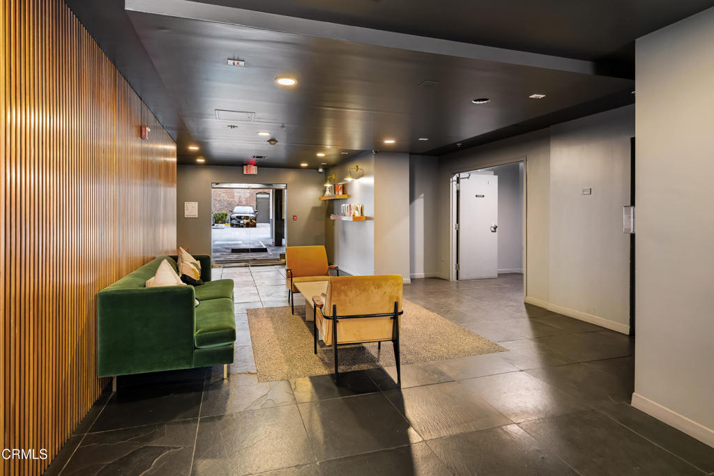 159 West Green Street, Unit 502A Pasadena, CA 91105 - Photo 4 of 40 a lobby with furniture and a potted plant