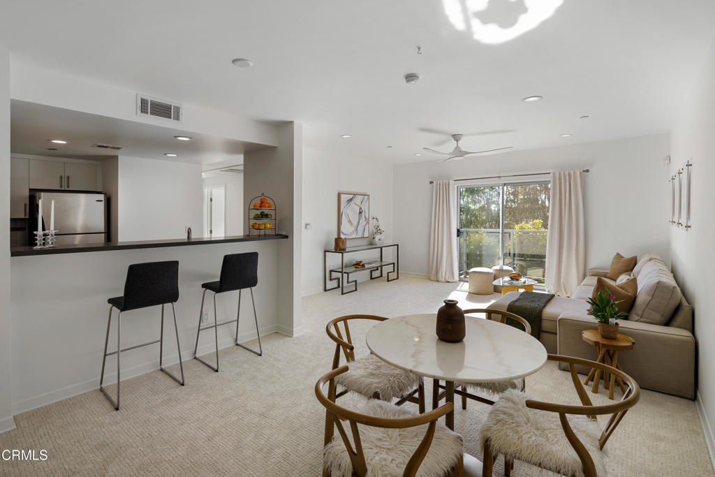 159 West Green Street, Unit 502A Pasadena, CA 91105 - Photo 7 of 40 a living room with furniture and a large window