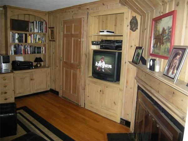 259 Varick Road Newton, MA 02468 - Photo 14 of 28 a living room with furniture and a fireplace