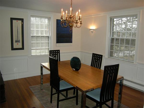 259 Varick Road Newton, MA 02468 - Photo 3 of 28 a view of a dining room with furniture and chandelier