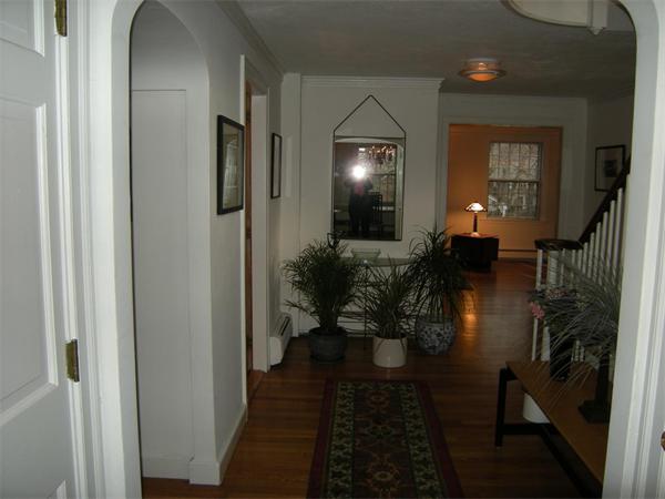259 Varick Road Newton, MA 02468 - Photo 5 of 28 a hallway with dining room and livingroom view