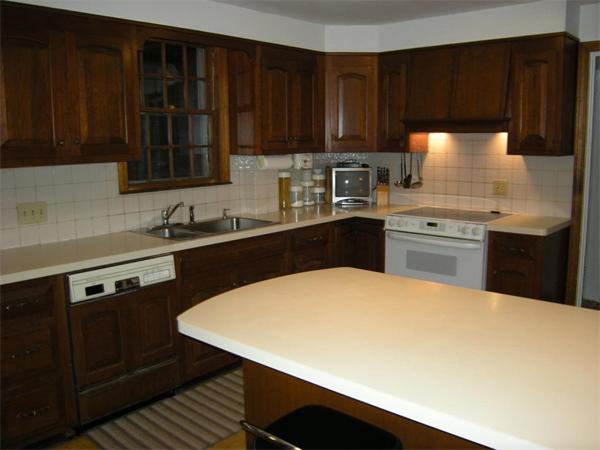 259 Varick Road Newton, MA 02468 - Photo 10 of 28 a kitchen with a sink a stove and cabinets