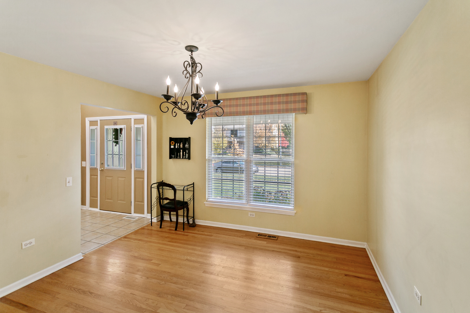 67 Raven Drive Aurora, IL 60506 - Photo 12 of 30 a view of a livingroom with wooden floor and a window