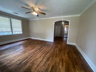 1703 39th Street, Unit A Columbus, GA 31904 - Photo 3 of 12 wooden floor in an empty room with a window