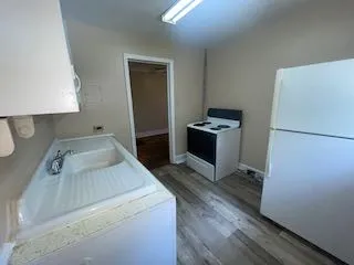 a kitchen with a stove and a refrigerator