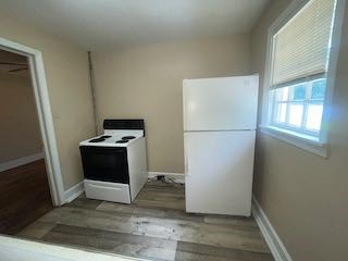 1703 39th Street, Unit A Columbus, GA 31904 - Photo 10 of 12 a view of kitchen with wooden floor and electronic appliances