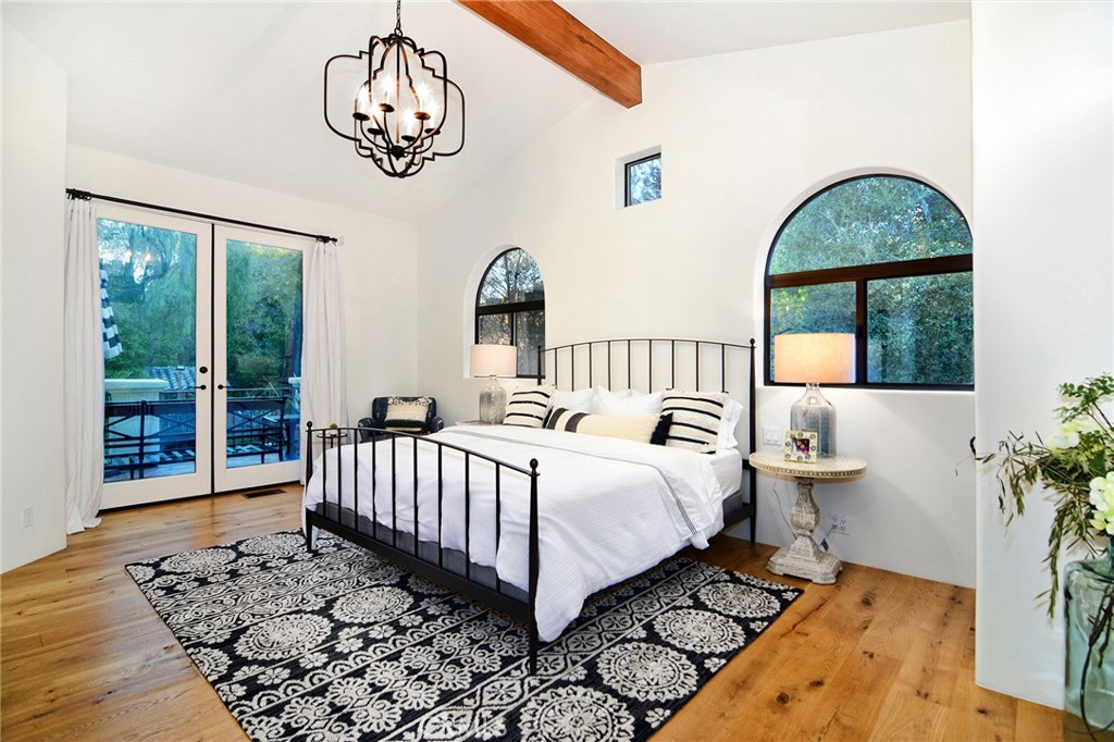 31350 Lobo Canyon Road Agoura Hills, CA 91301 - Photo 11 of 24 a bed sitting in a bedroom next to a window