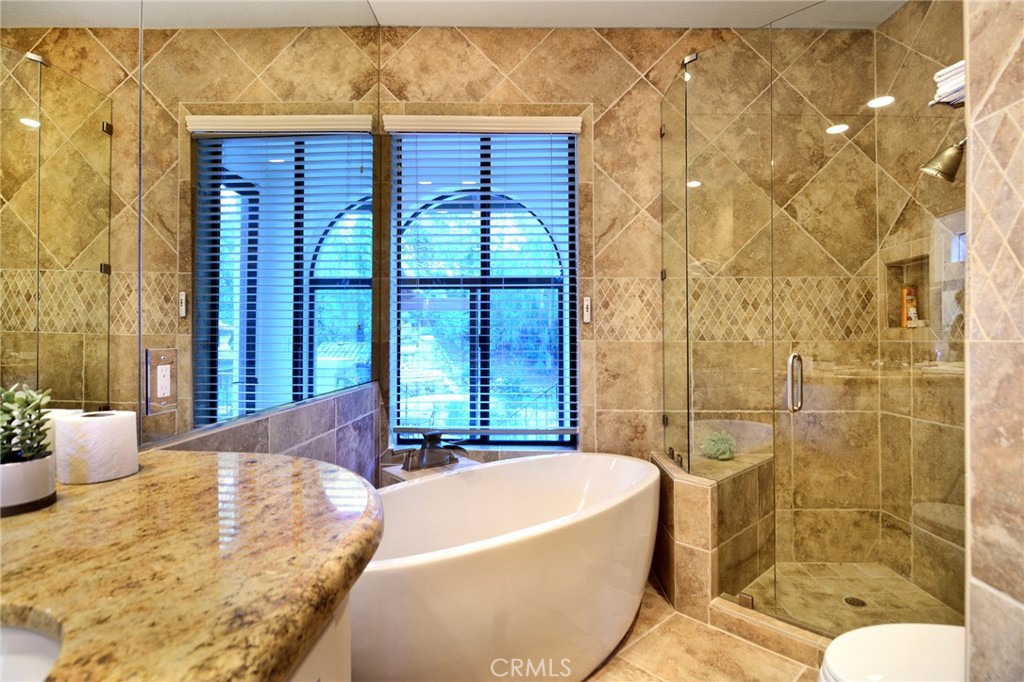 31350 Lobo Canyon Road Agoura Hills, CA 91301 - Photo 12 of 24 a bath tub sitting in a bathroom next to a tub