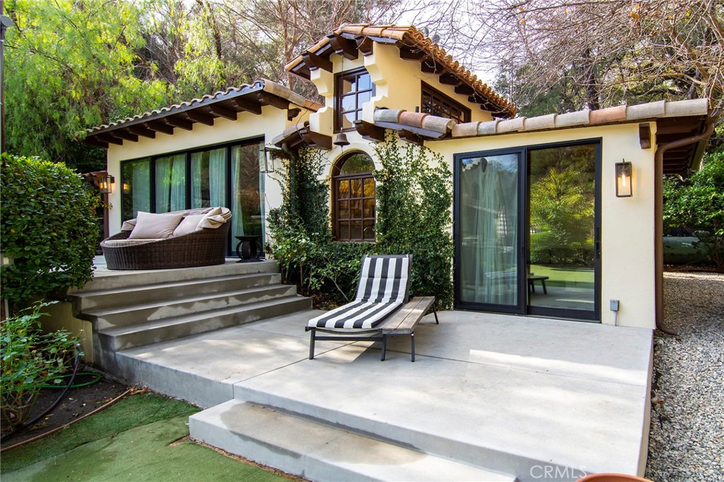 31350 Lobo Canyon Road Agoura Hills, CA 91301 - Photo 15 of 24 a front view of a house with a garden and porch