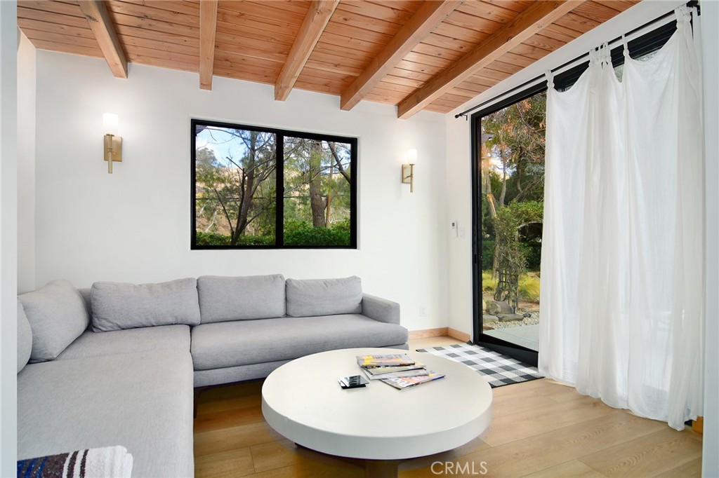 31350 Lobo Canyon Road Agoura Hills, CA 91301 - Photo 16 of 24 a living room with furniture and a large window