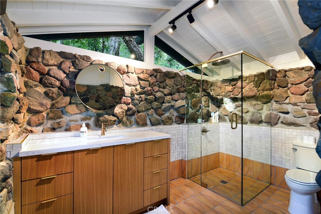 31350 Lobo Canyon Road Agoura Hills, CA 91301 - Photo 21 of 24 a bathroom with a sink mirror and tub