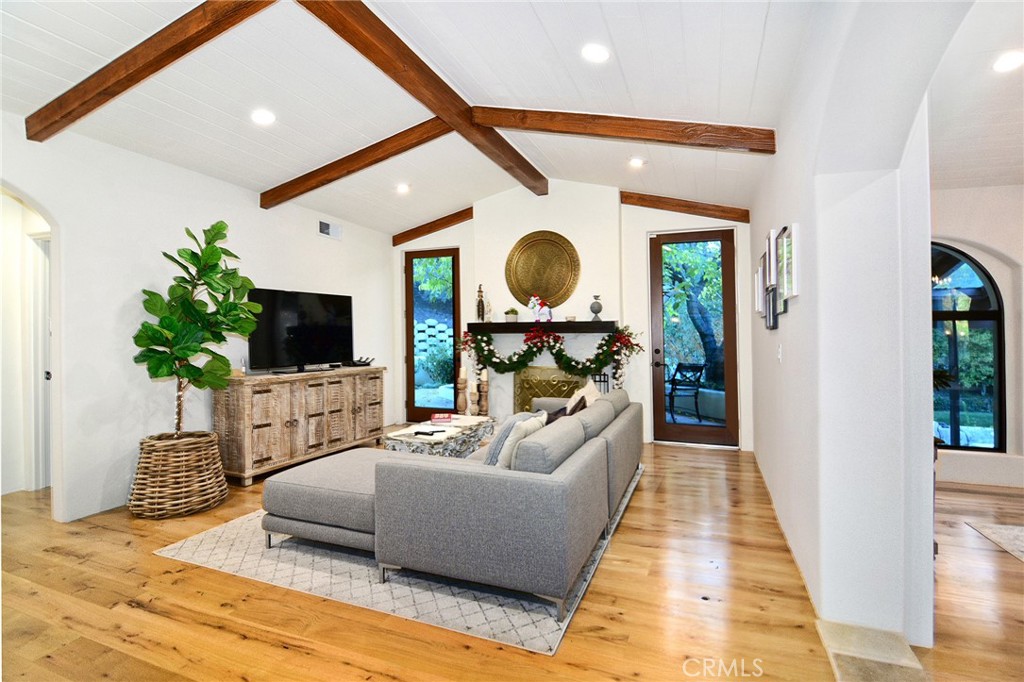 31350 Lobo Canyon Road Agoura Hills, CA 91301 - Photo 6 of 24 a living room with furniture and a flat screen tv