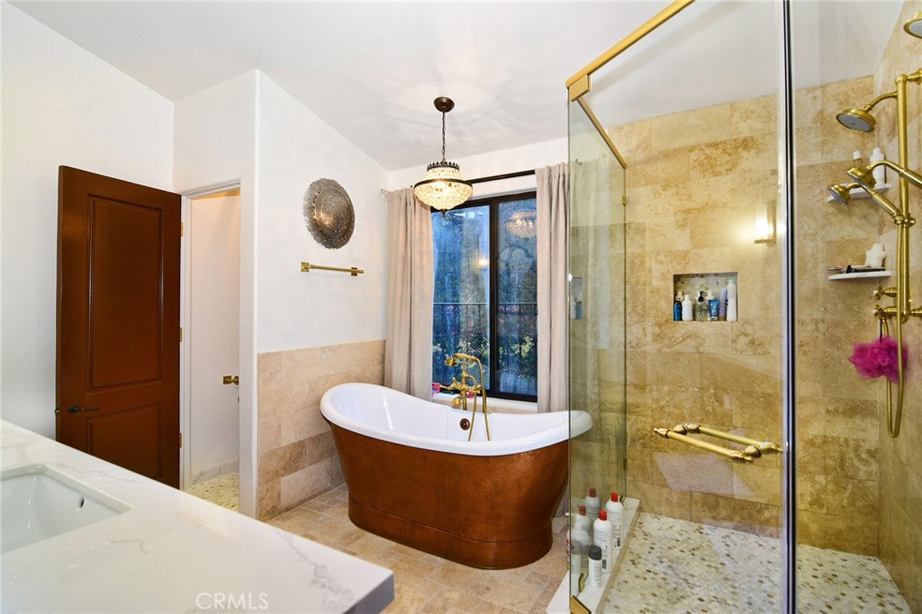 31350 Lobo Canyon Road Agoura Hills, CA 91301 - Photo 9 of 24 a bathroom with a tub shower sink and mirror