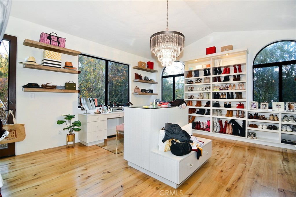 31350 Lobo Canyon Road Agoura Hills, CA 91301 - Photo 10 of 24 a living room filled with furniture and a chandelier