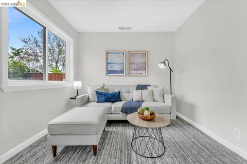 a living room with furniture and a table