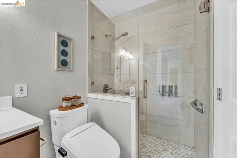 a white toilet sitting next to a bathroom sink