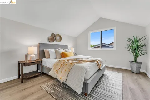 a bedroom with bed and window